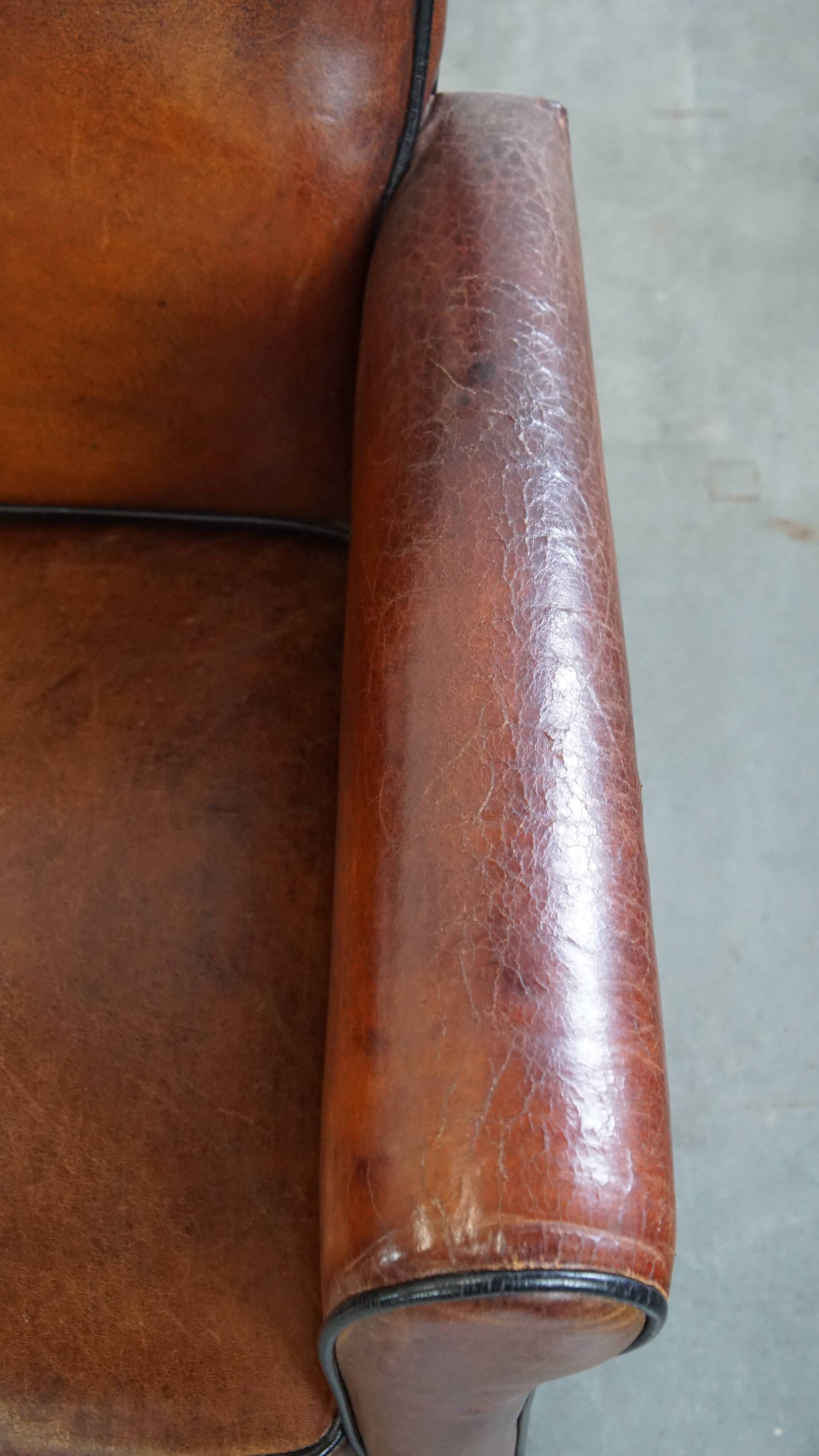 Vintage set of 4 sheepskin leather dining chairs on castors