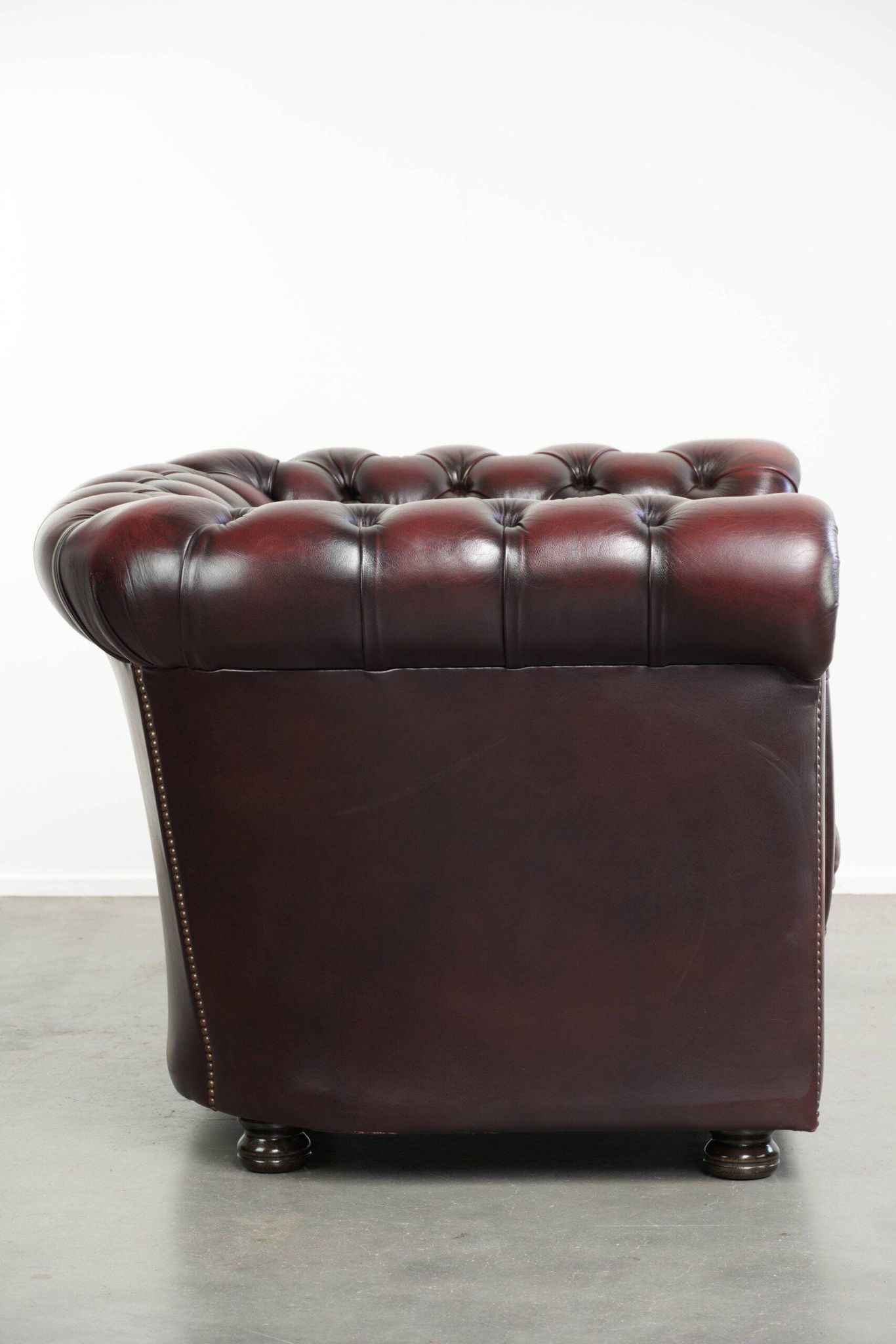 English cowhide Chesterfield club armchair in a beautiful red colour