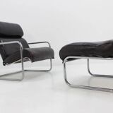 Ensemble fauteuil lounge et repose-pieds en cuir tubulaire chromé - années 1950