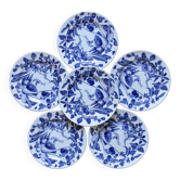 Antique ironstone plates with a garden decoration.