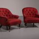 Pair of French red fabric button back armchairs