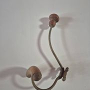 Vintage 1960s wall coat rack in wood and metal.