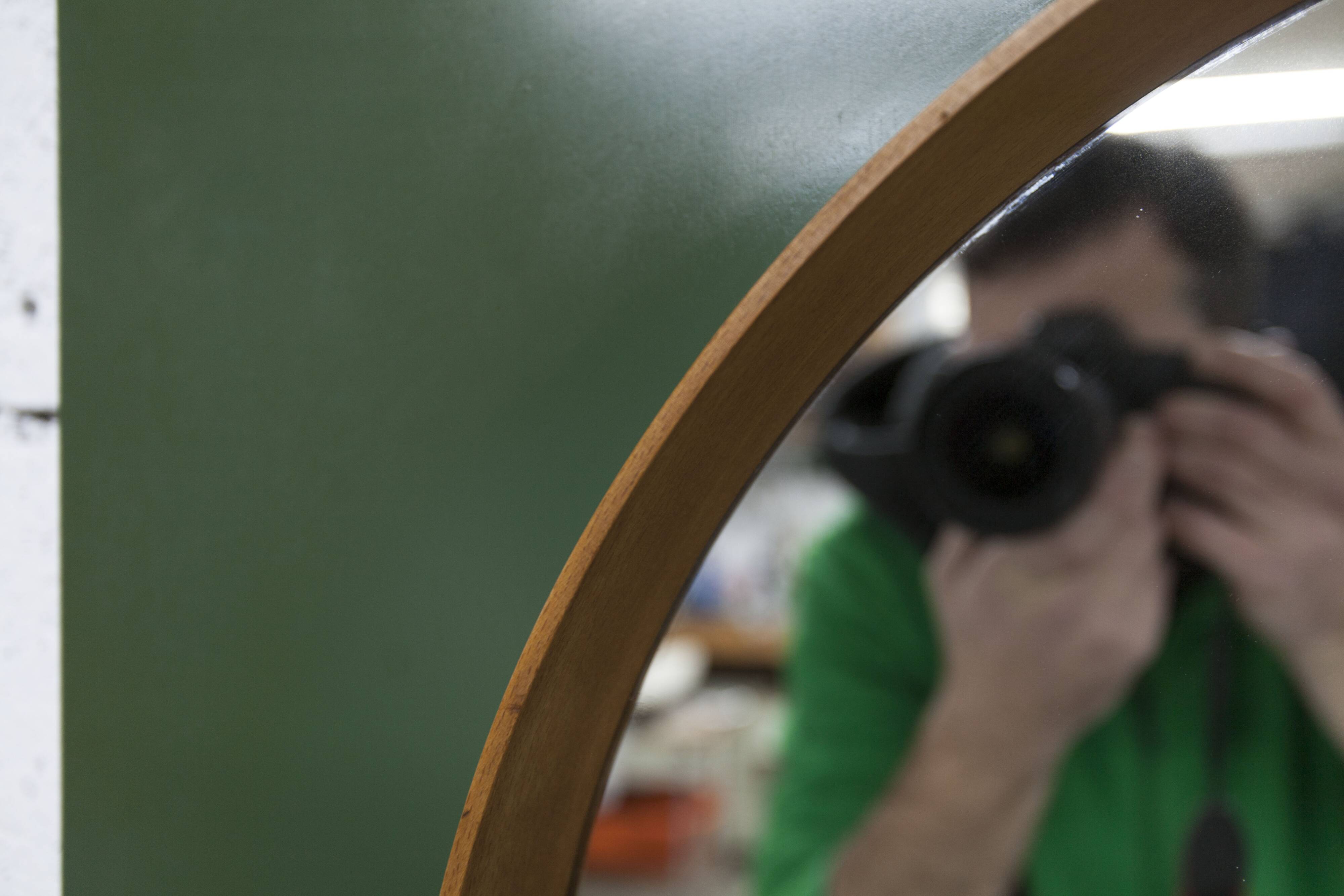 Unusual round wall mirror 60 cm teak edge on green rectangular board 1960.
