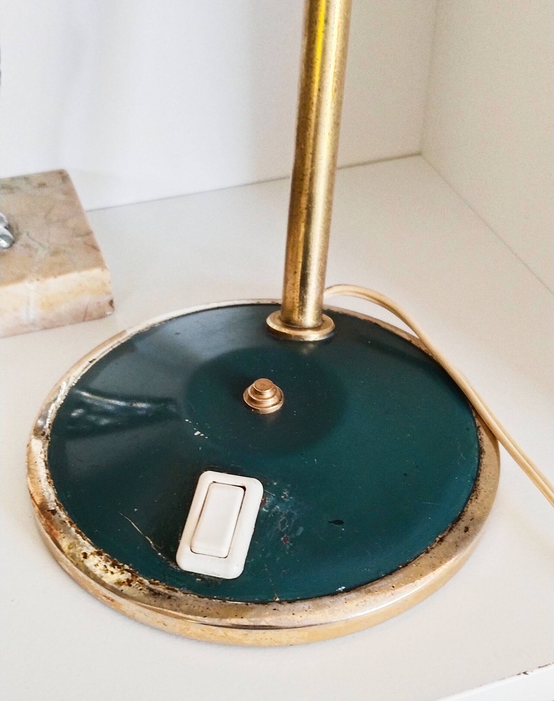 Green and gold articulated desk lamp