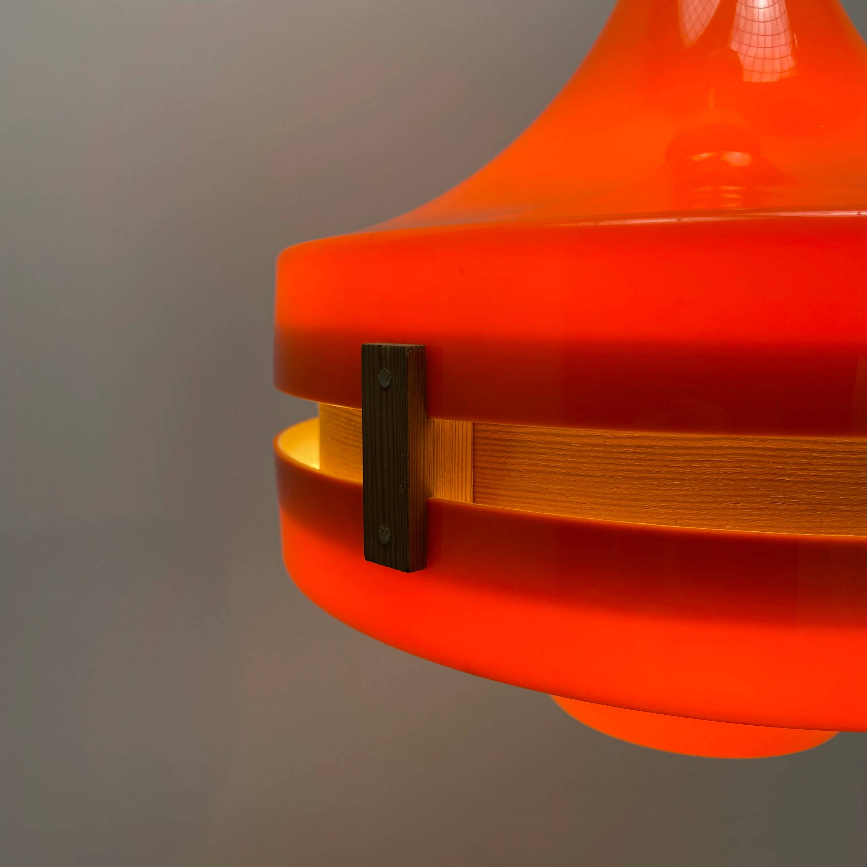 1970s orange Scandinavian suspension light in plexiglass shaped like a UFO.