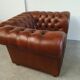 Brown leather chesterfield armchair