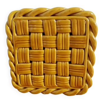 Openwork woven ceramic trivet