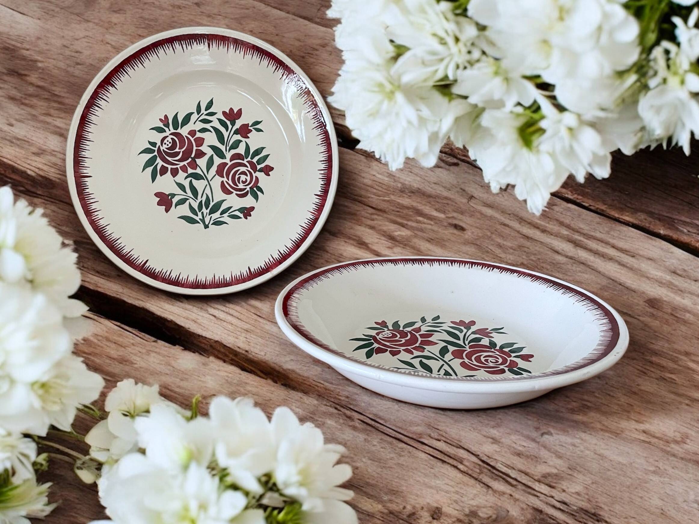 Antique plates and salad bowls in Longwy faience.