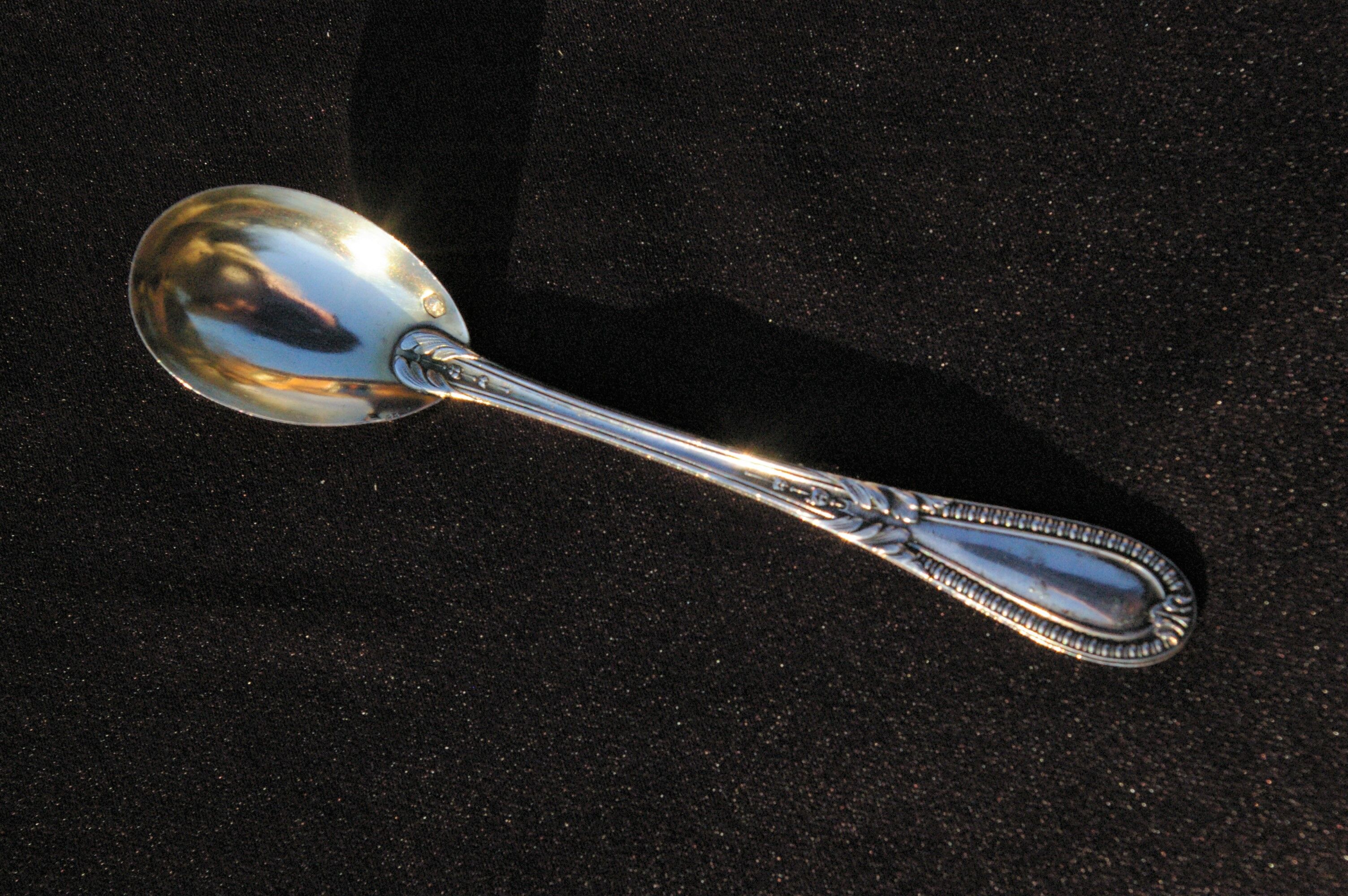 Egg spoon in solid silver and vermeil