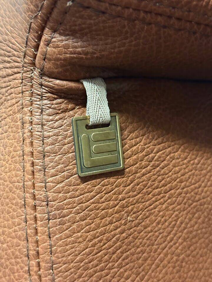 Leather  2-piece set-sofa and armchair from Elastoform