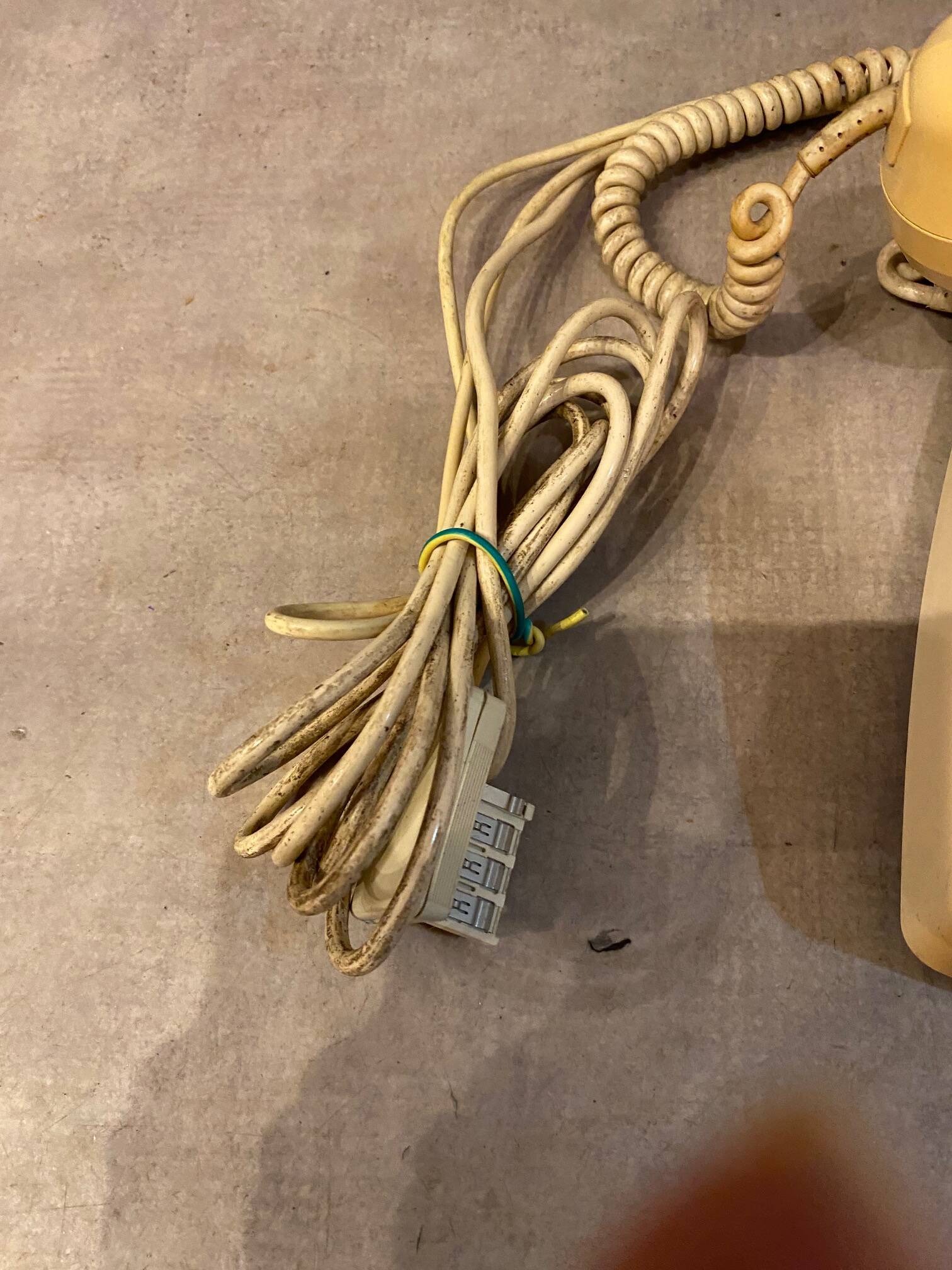 Old dial telephone from the 80s temat quimper bakelite yellow and beige