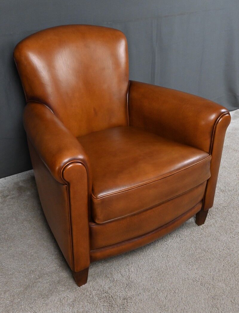 Paire de fauteuils club en cuir