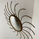 Mid century gold sunburst mirror with convex glass.