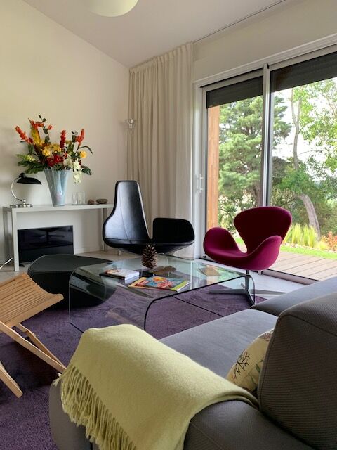 Moroso Fjord armchair with its pouf, design Patricia Urquiola 2002, steel and smooth black leather