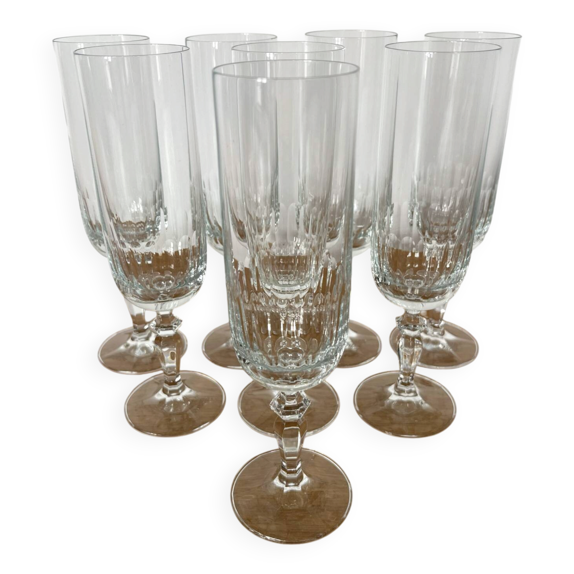 Set of 8 crystal champagne flutes in classic design.