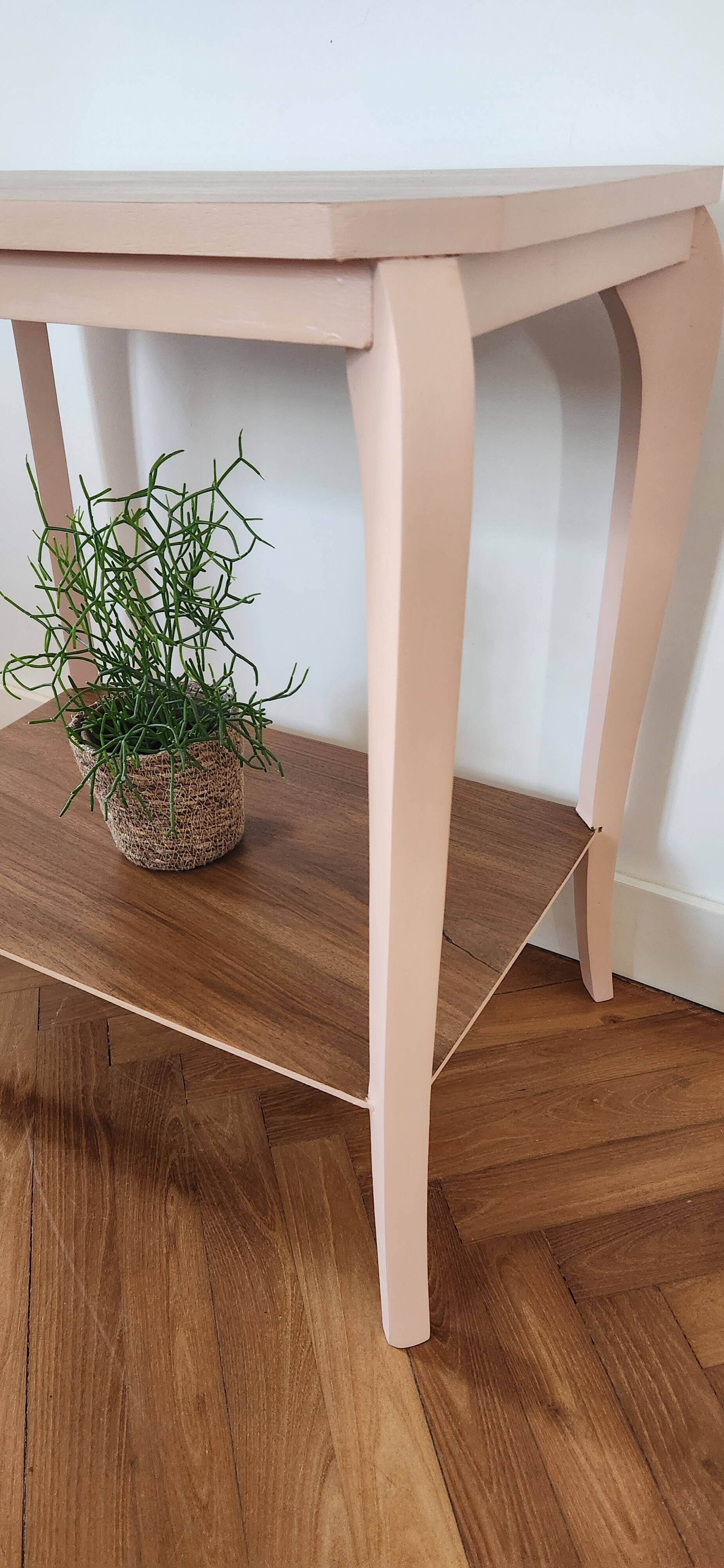 Side table with curved pink legs