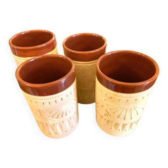 Four hand-carved ceramic glasses