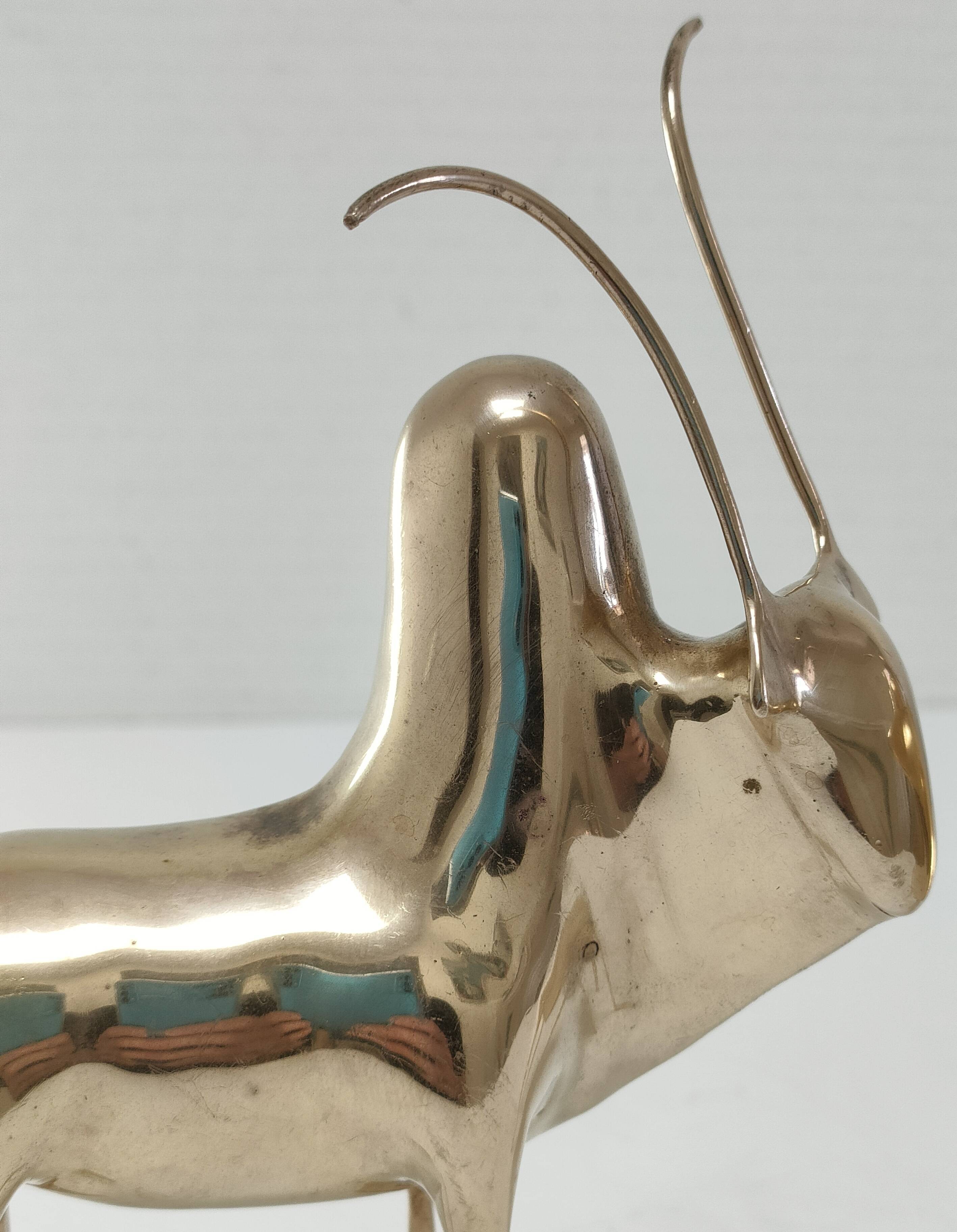 Two stylized zebu with long vintage brass horns