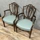 According to George Hepplewhite: pair of 19th century mahogany office armchairs