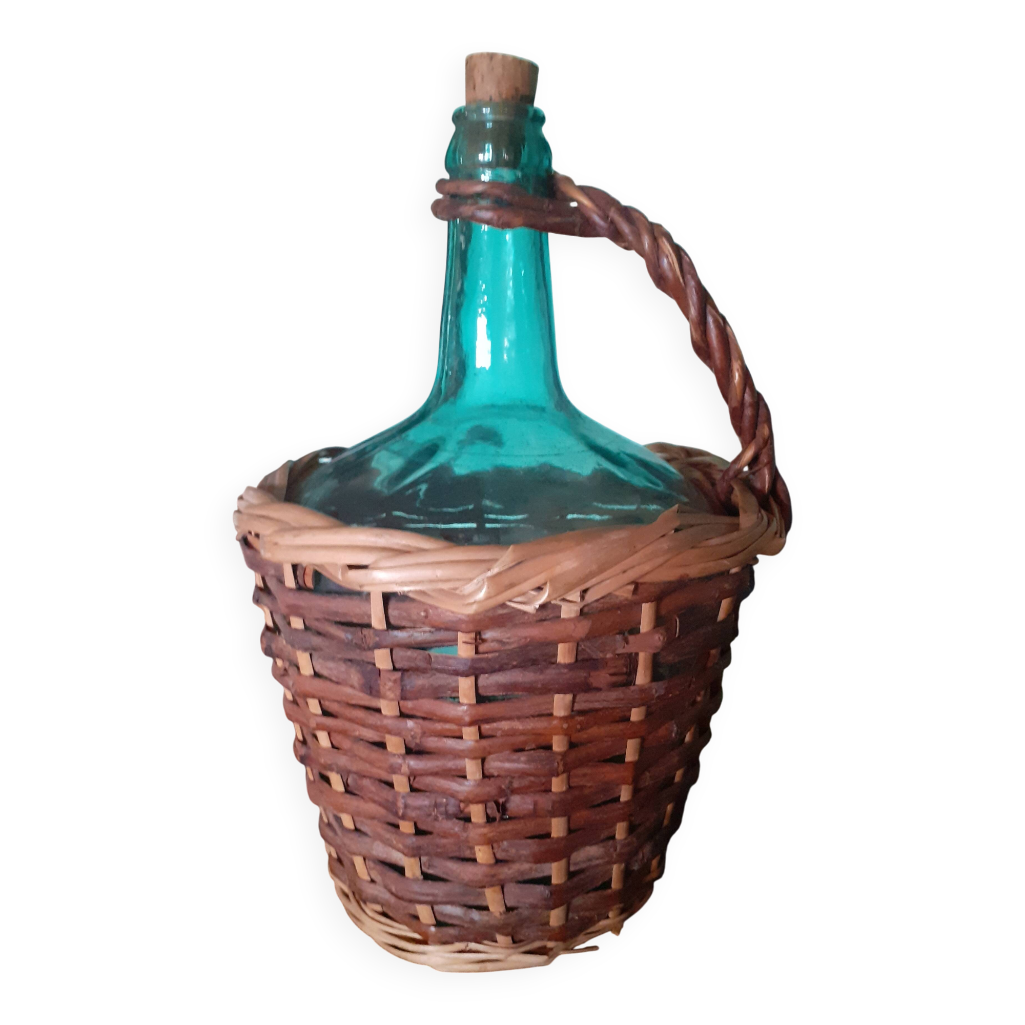 Glass bottle in its wicker dress