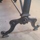 Large bistro table with a wooden top and cast iron legs - 2m56