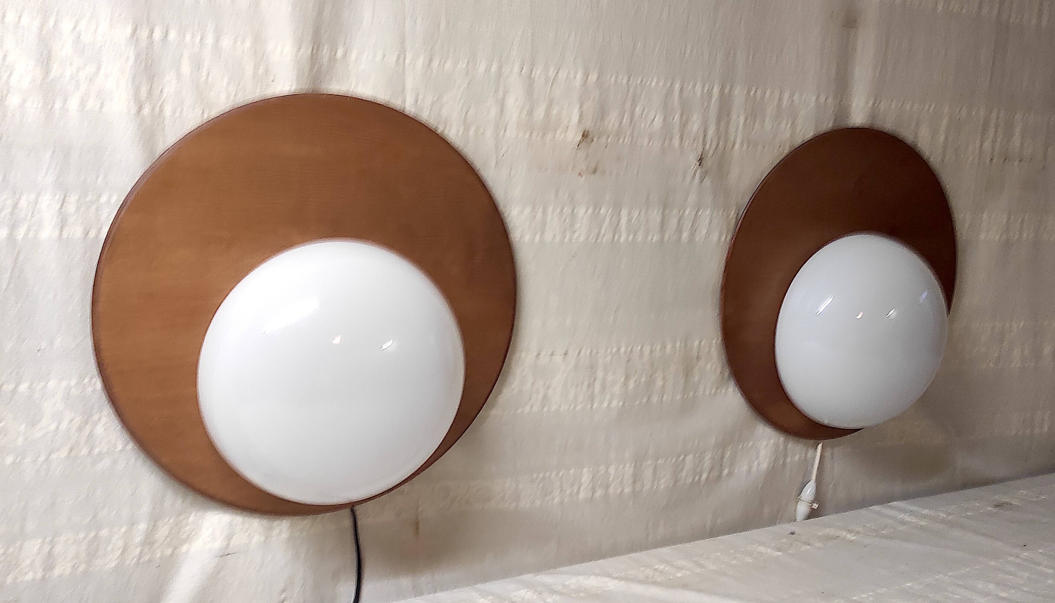 Designer wall lights in wood and opaline globe - mid-20th century