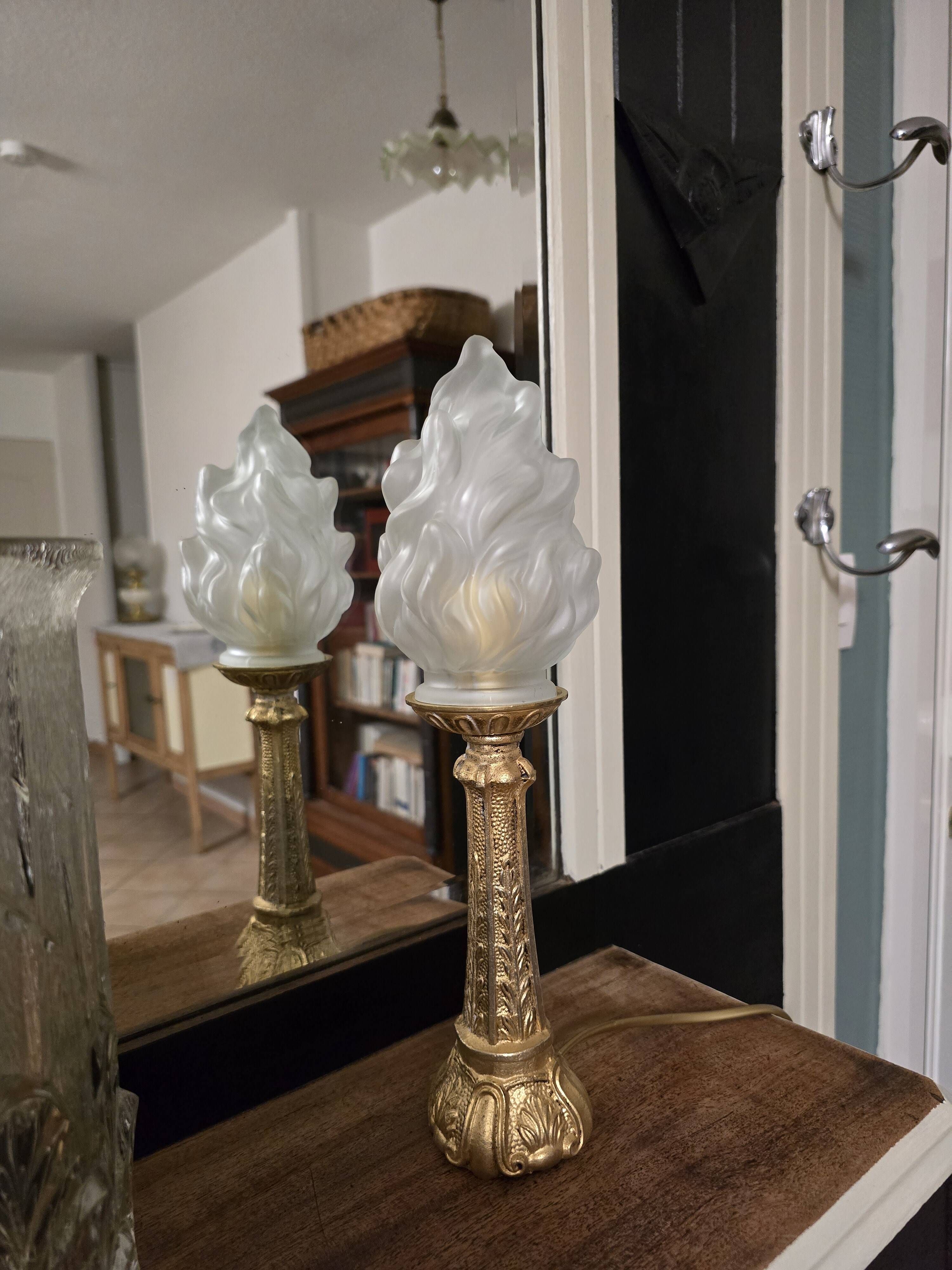 Table lamp with brass base and vintage flame globe