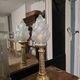 Table lamp with brass base and vintage flame globe