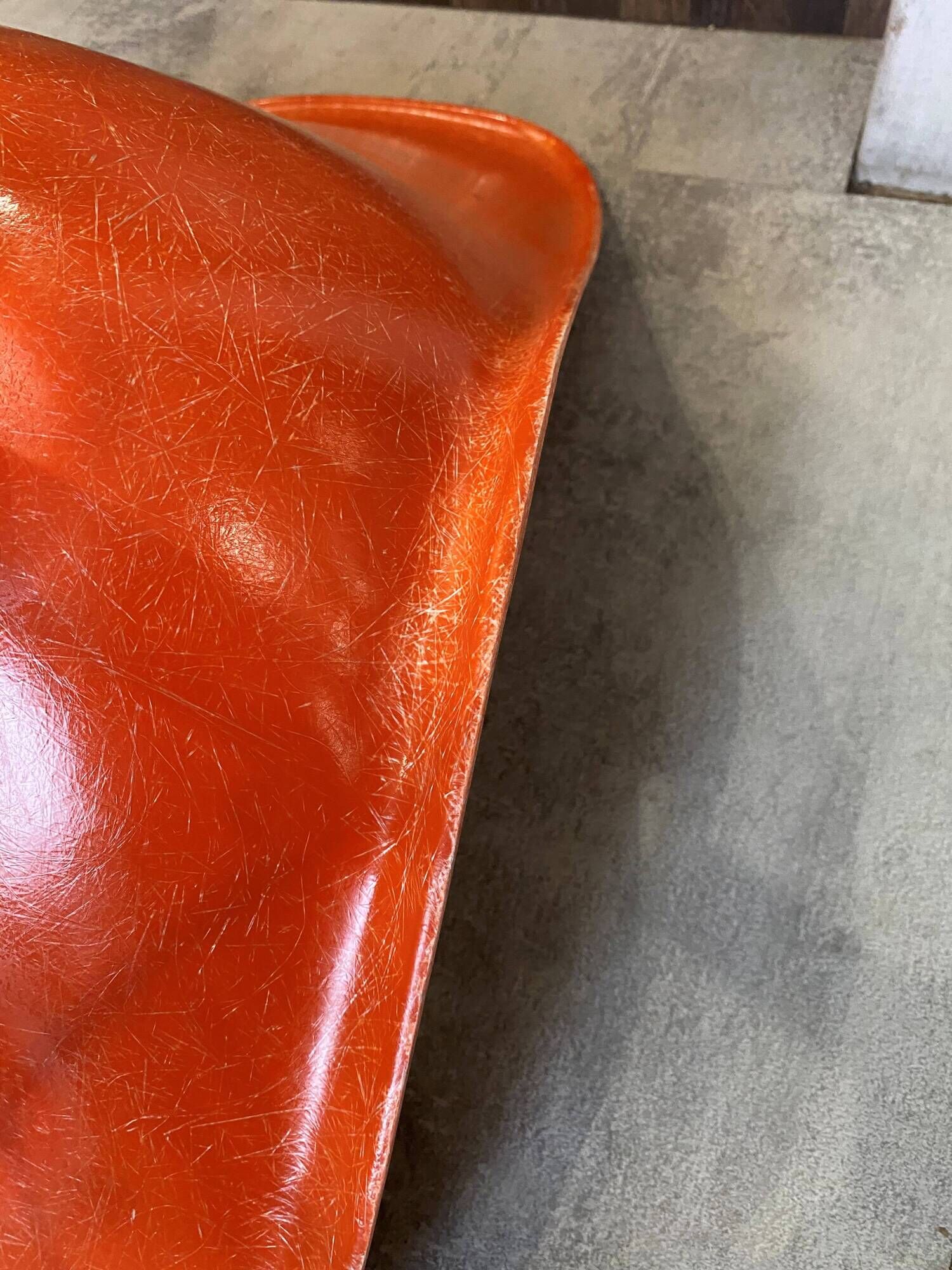 A vintage 70s Eames Herman Miller DSW Fiber Red Orange Dowel Walnut Chair