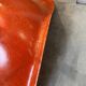 A vintage 70s Eames Herman Miller DSW Fiber Red Orange Dowel Walnut Chair