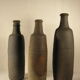 Three old sandstone bottles