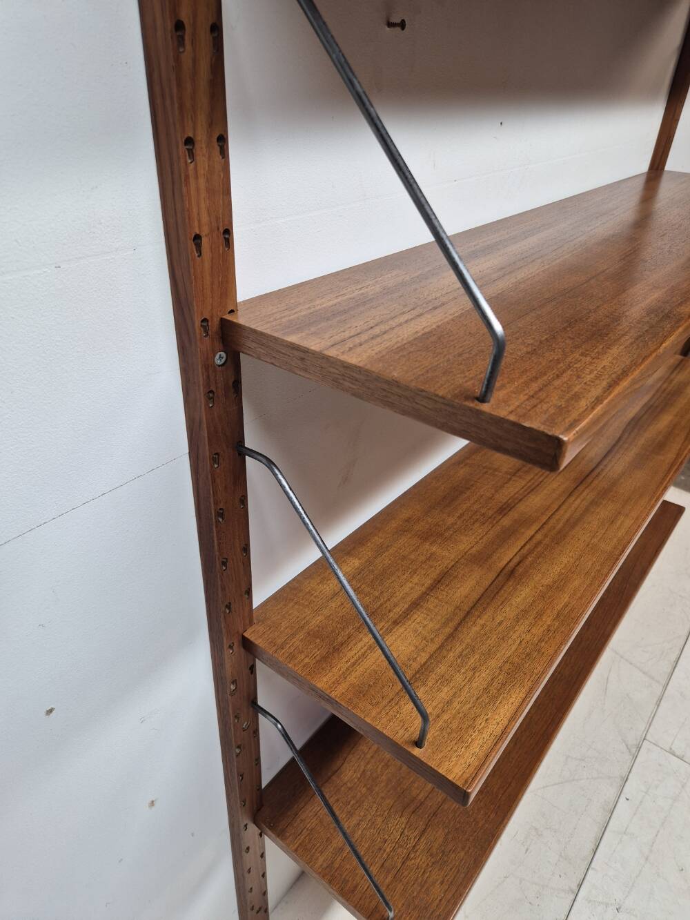 Teak shelving system, marked made in Denmark, 1960.