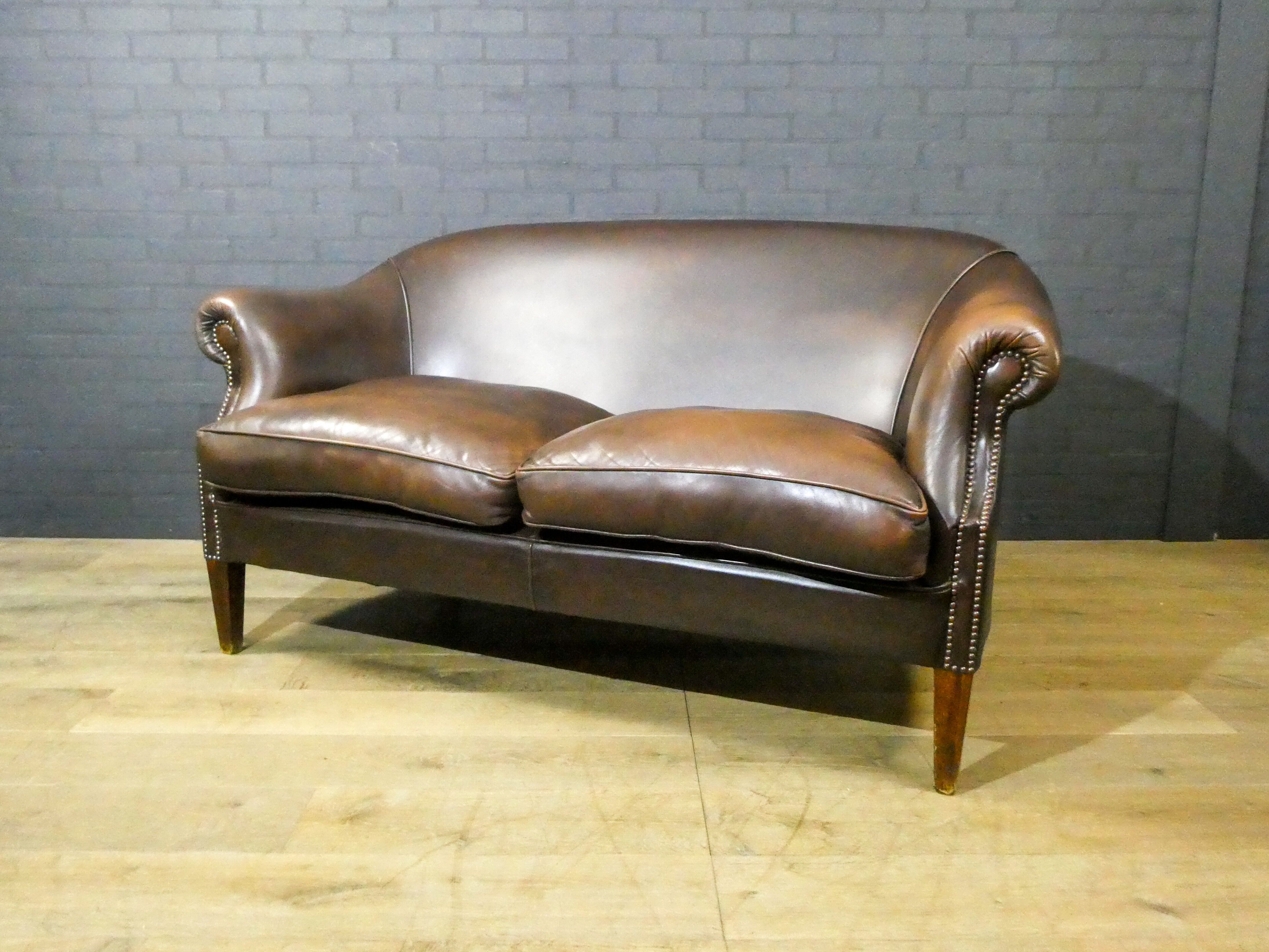 Vintage leather 2-seater sofa in dark brown