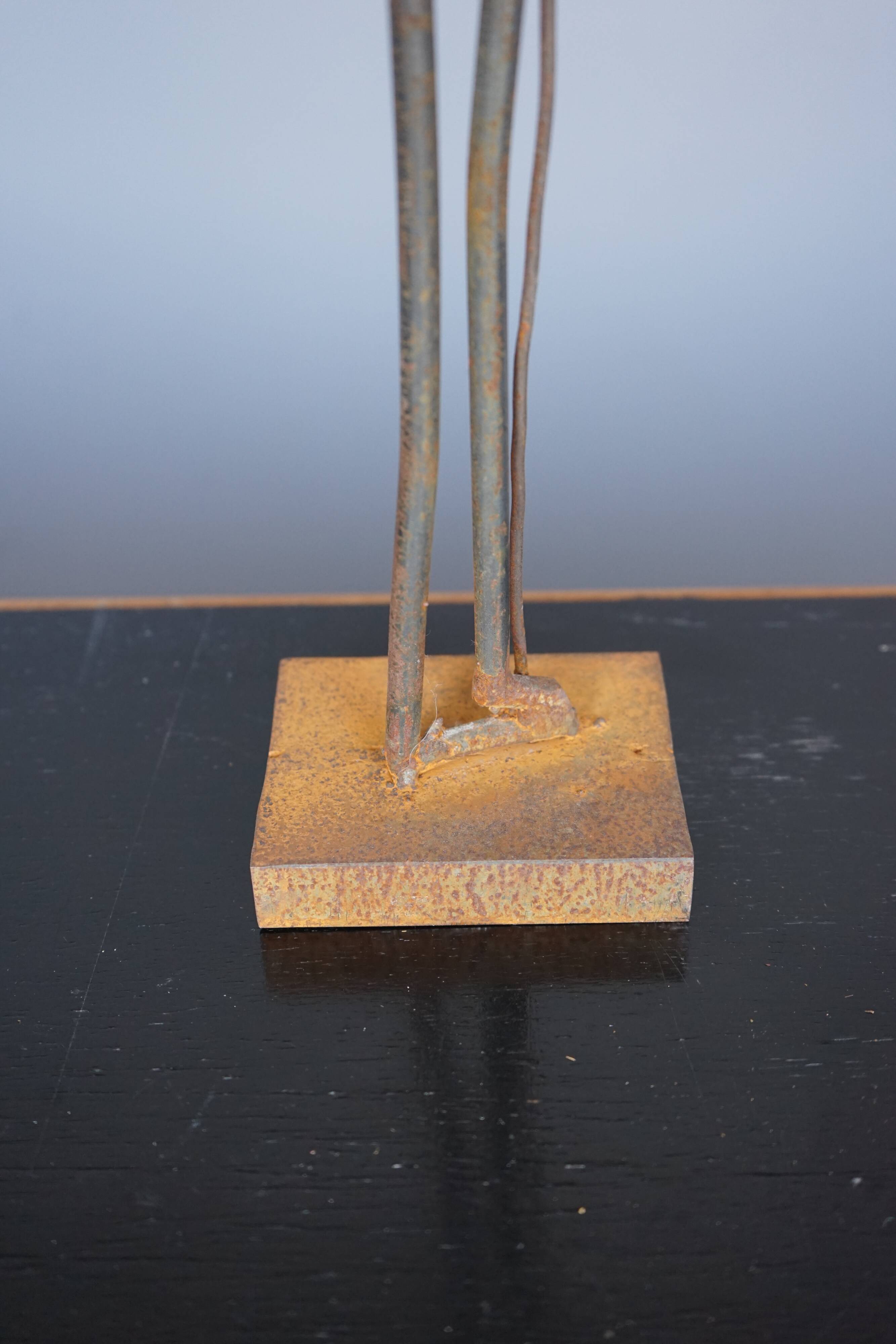 Metal Sculpture of a Standing Figure