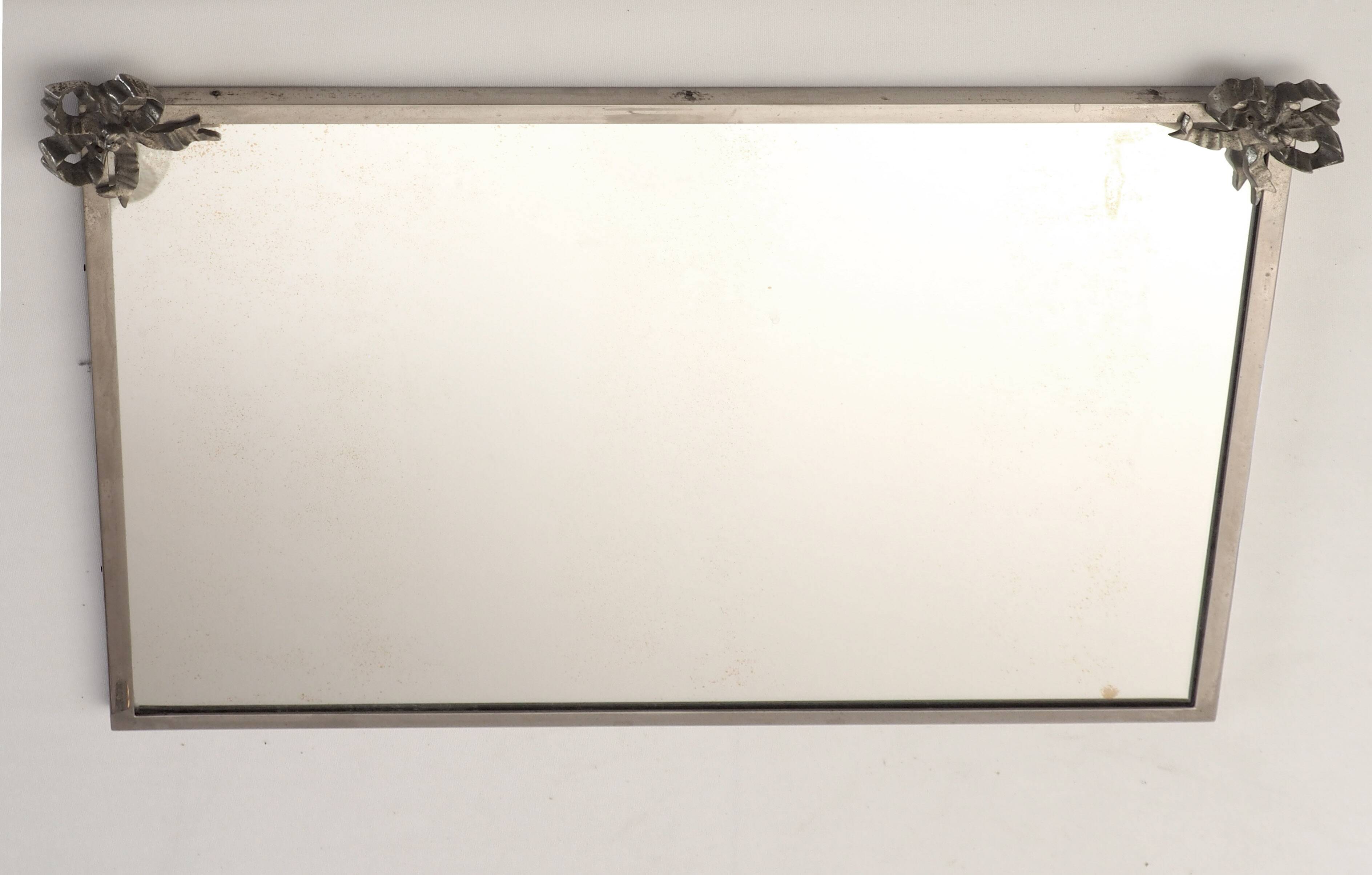 Antique mirror with silver metal rim