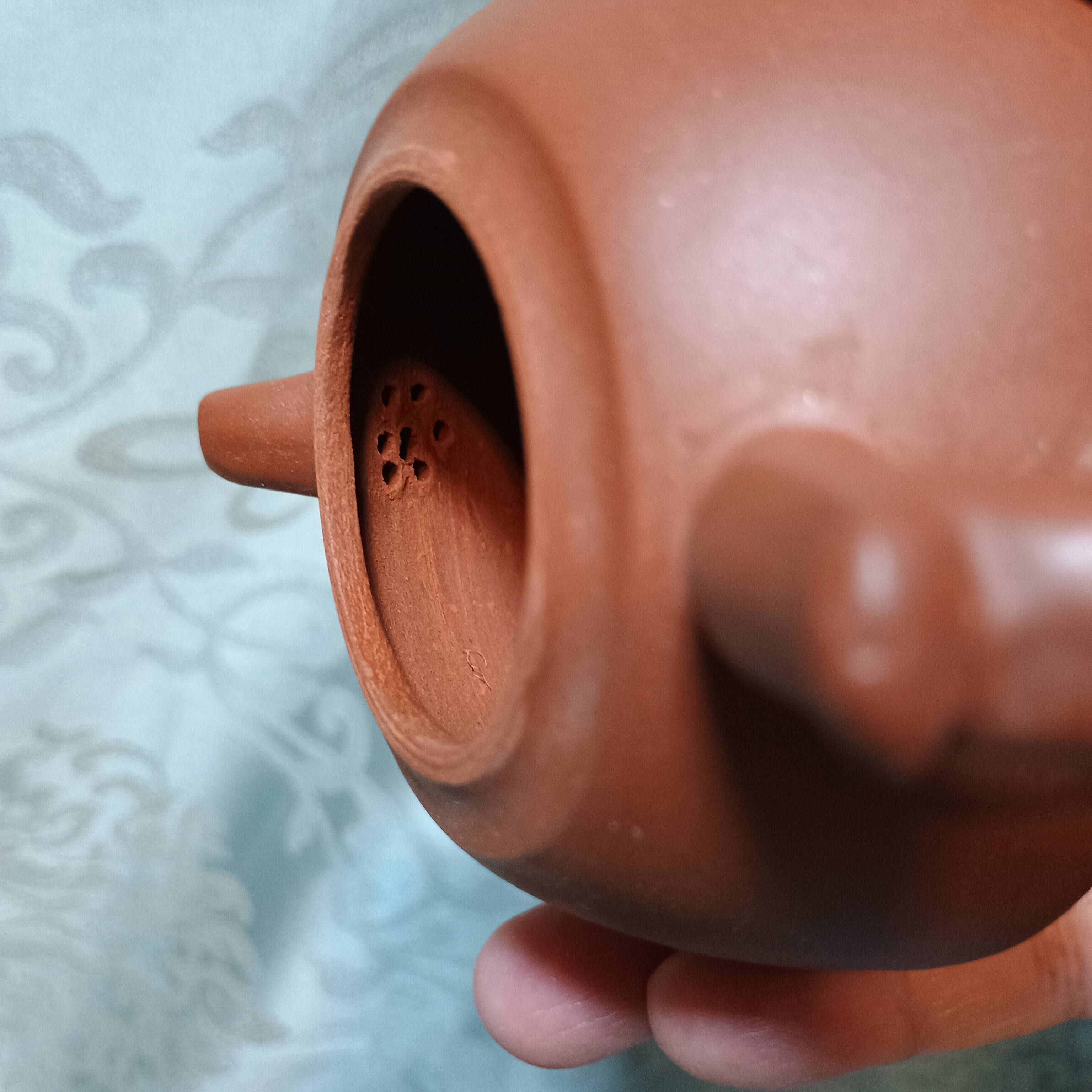 Yixing teapot in signed red clay