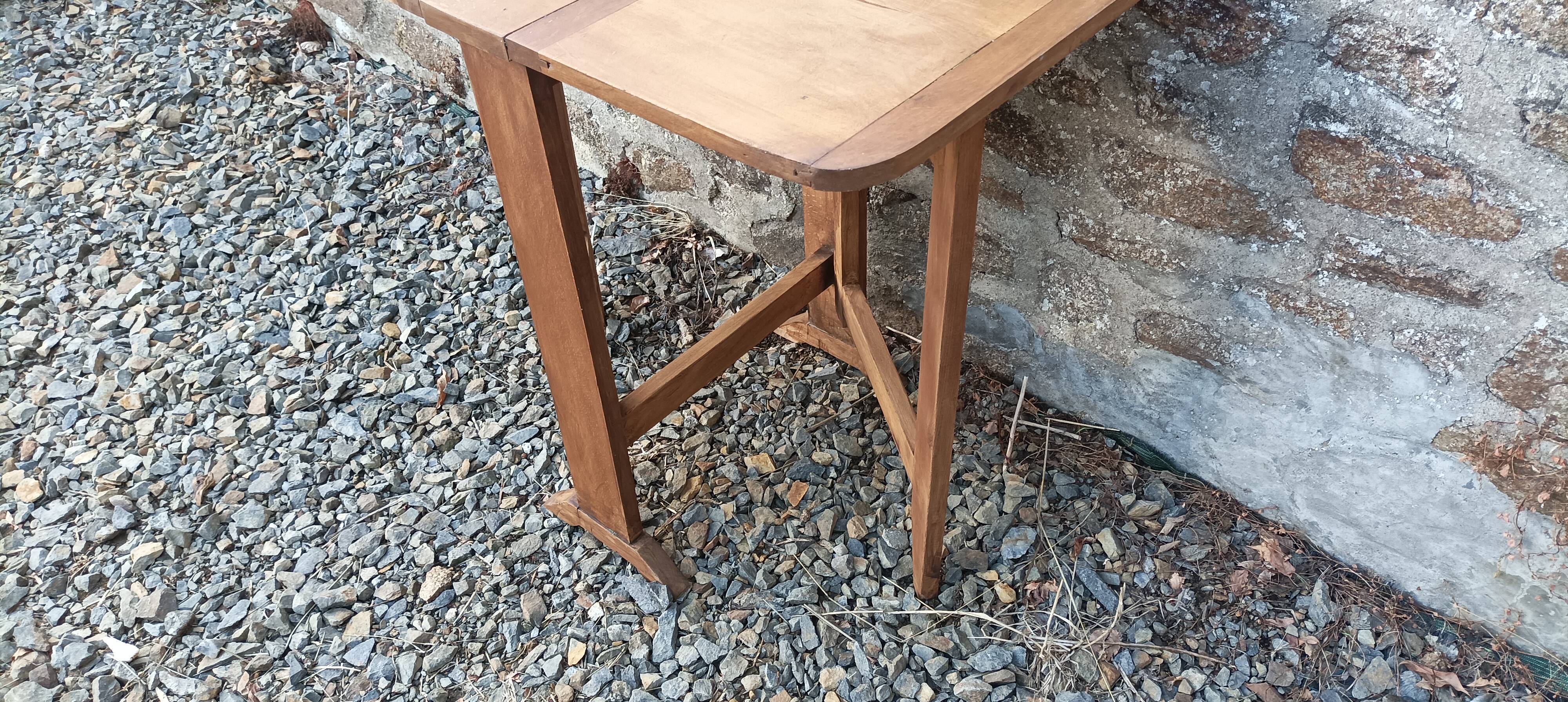 Old wooden table with double swings
