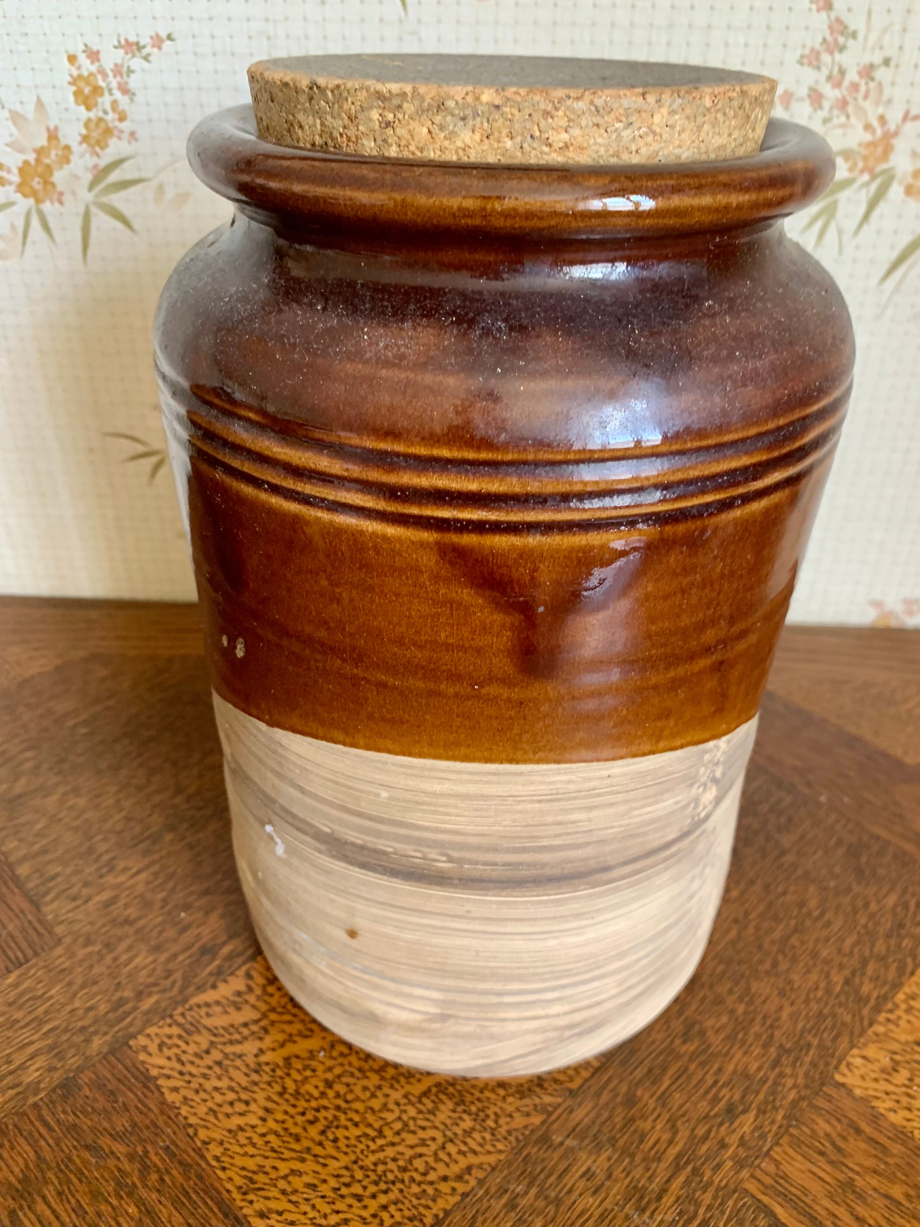 Old sandstone pot with cork lid