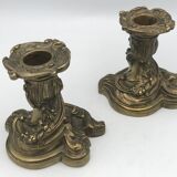 Pair of gilded bronze candlesticks with twisted decor and floral garlands, louis xv style