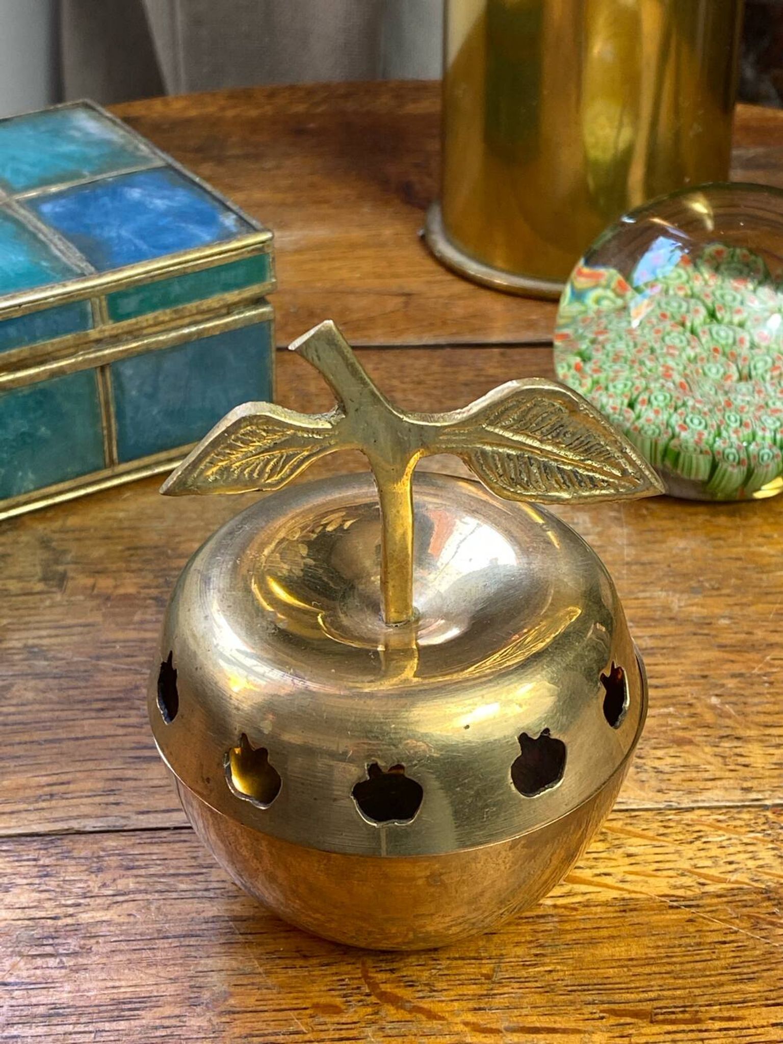 Bonbonnière, in the shape of an apple, made of brass.