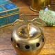 Bonbonnière, in the shape of an apple, made of brass.