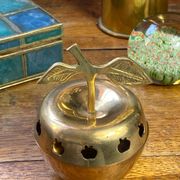 Bonbonnière, in the shape of an apple, made of brass.