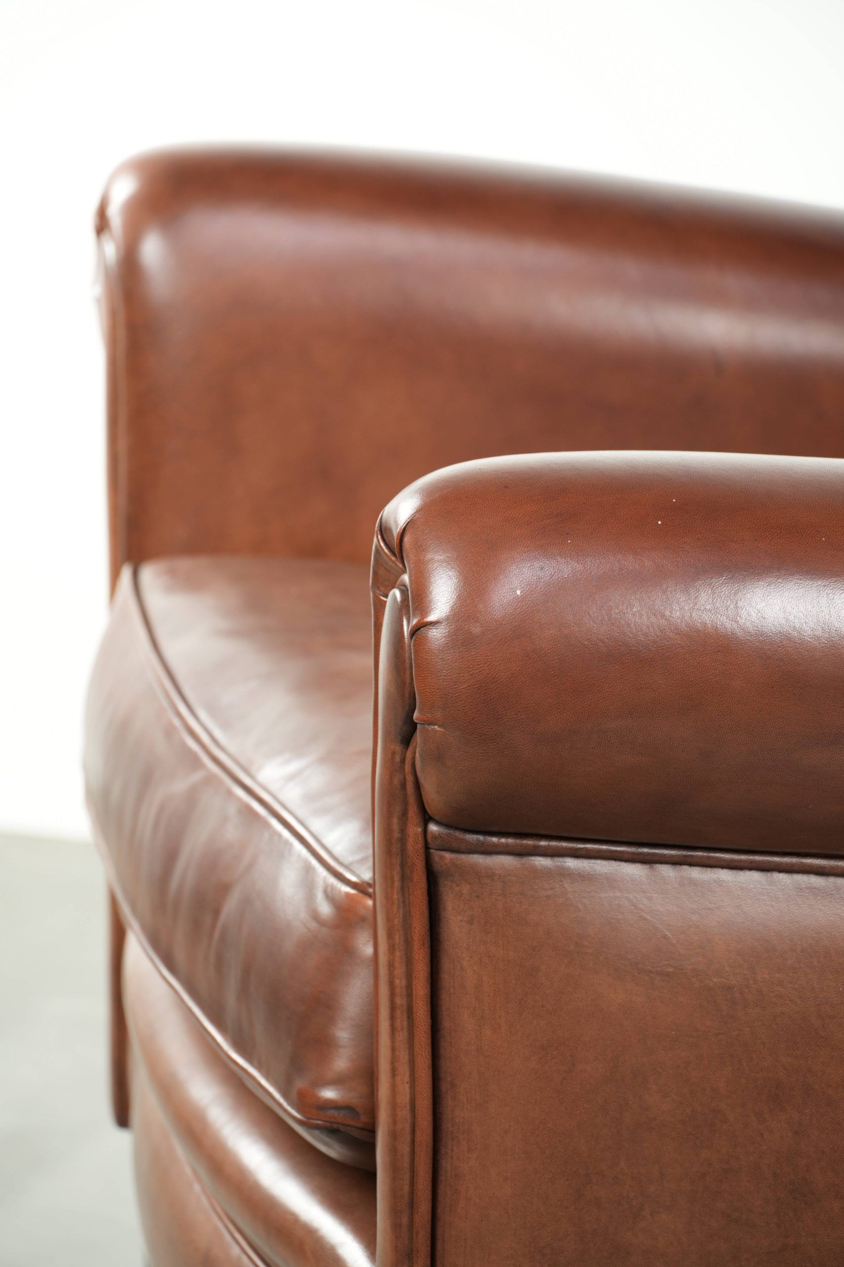 Large sheepskin wingback armchair in timeless English style
