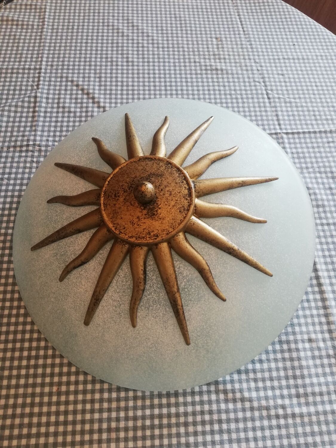 White opaque glass ceiling light and golden metal sun