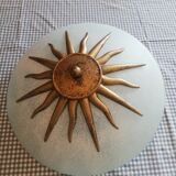 White opaque glass ceiling light and golden metal sun