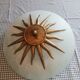White opaque glass ceiling light and golden metal sun
