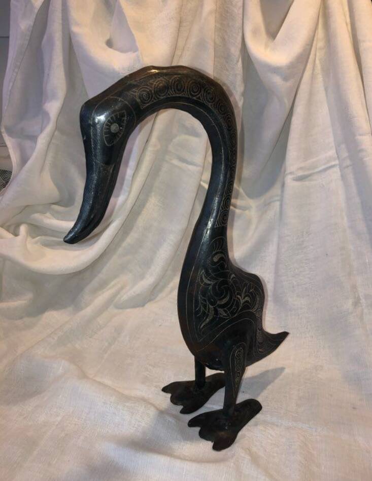 Damascened metal bird sculpture