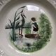 Vintage hollow serving dish with a decoration: marsh landscape.