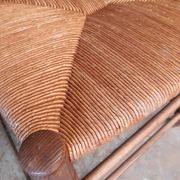 Pair of country-style straw chairs.
