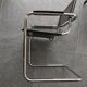 Metal and black leather design armchair pair
